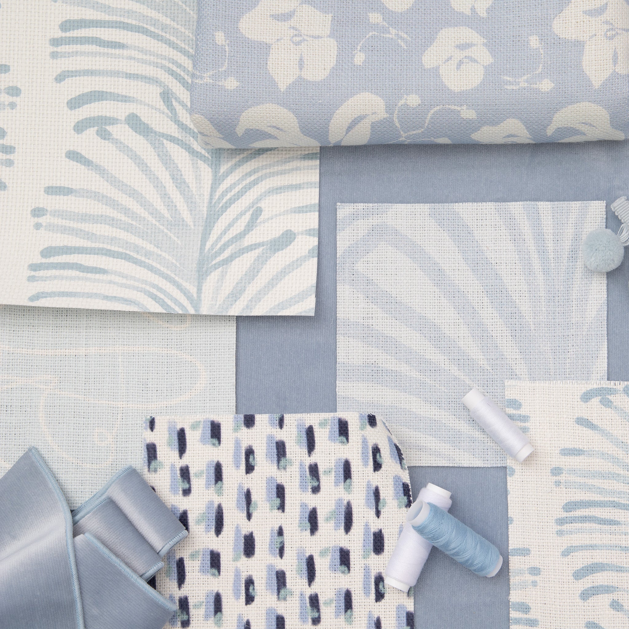 Interior design moodboard and fabric inspirations with Cornflower Blue Floral Printed Linen Swatch, Sky Blue Palm Printed Linen Swatch, Sky and Navy Blue Poppy Printed Linen Swatch, and Sky Blue Botanical Stripe Printed Swatch