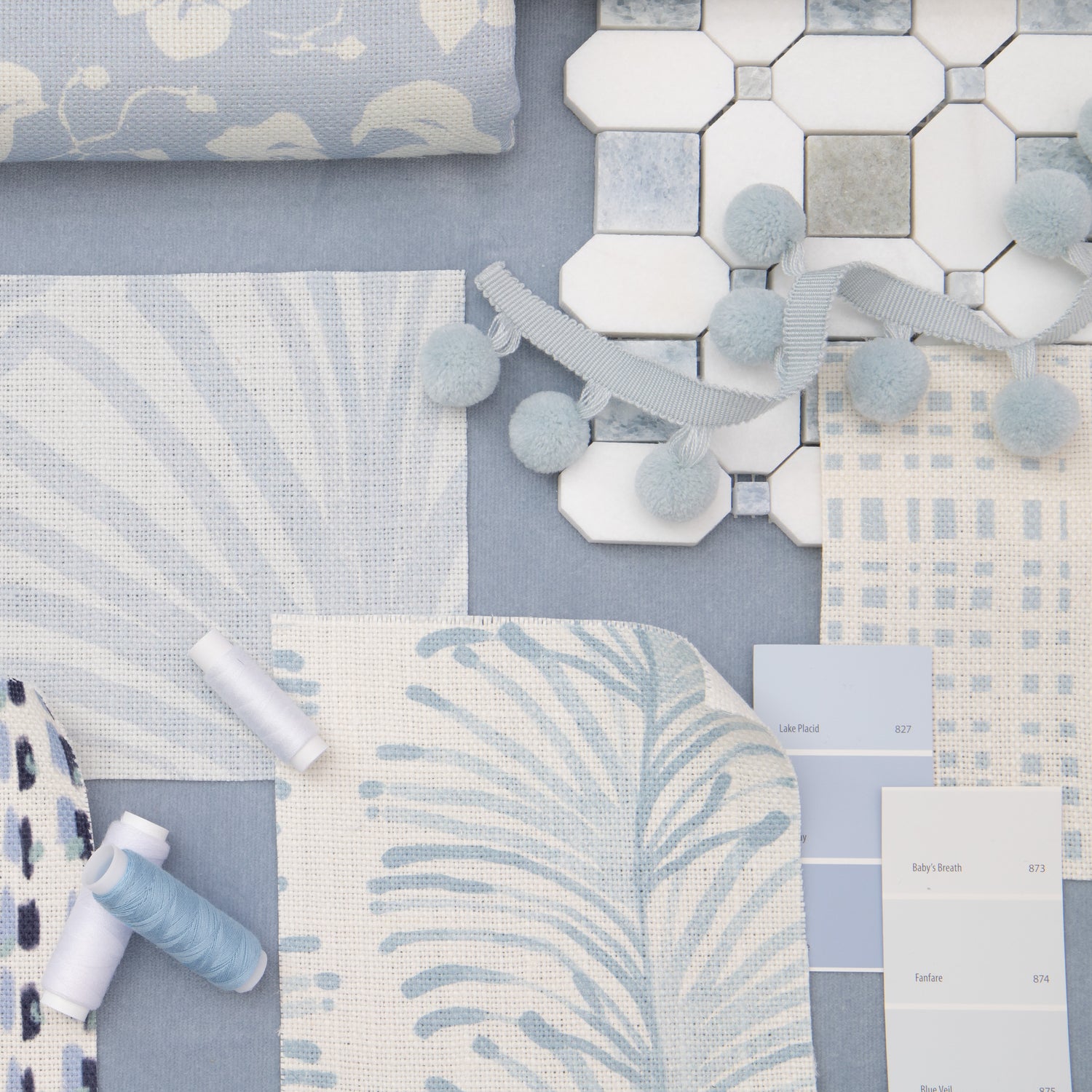 Interior design moodboard and fabric inspirations with Cornflower Blue Floral Printed Linen Swatch, Sky Blue Palm Printed Linen Swatch, Sky and Navy Blue Poppy Printed Linen Swatch, and Sky Blue Botanical Stripe Printed Swatch