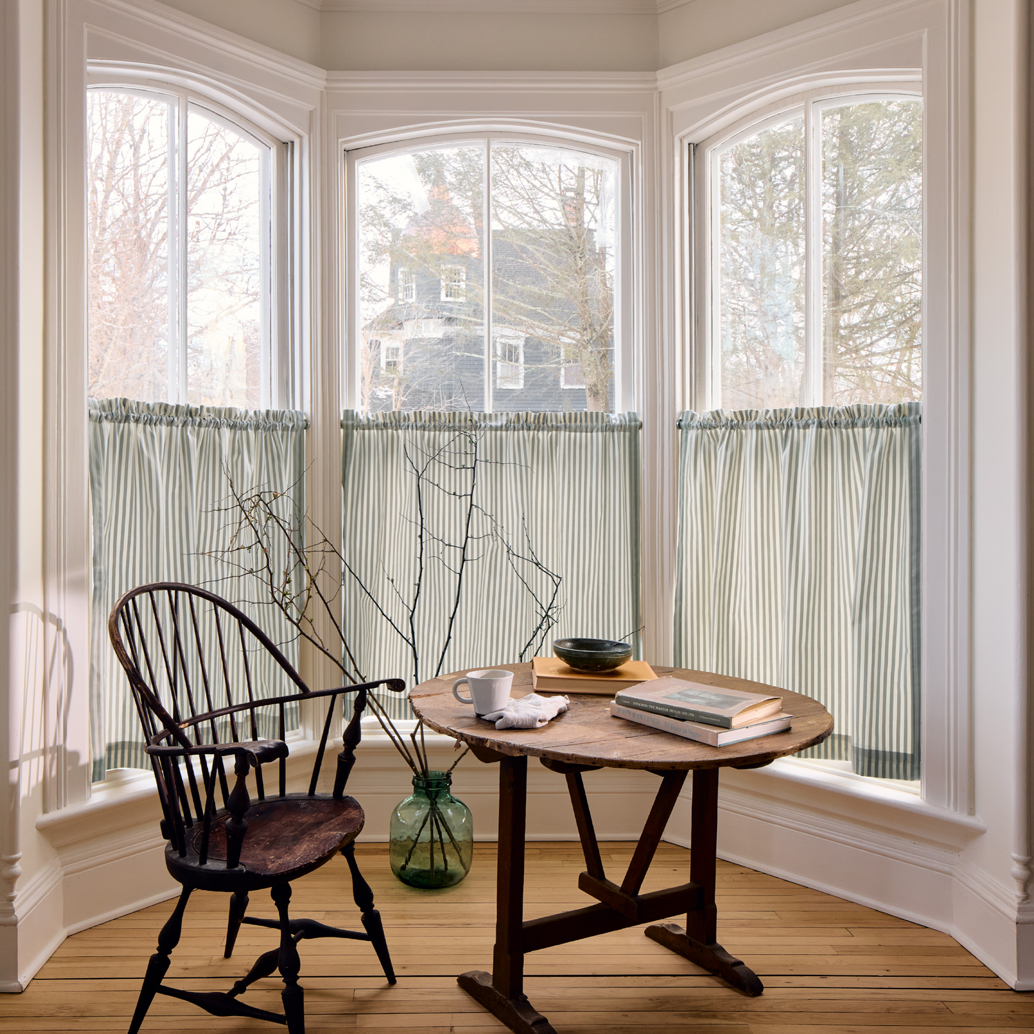 Louisa Sage custom cafe curtains in soft muted green stripes, perfect for effortless layering by Pepper Home.