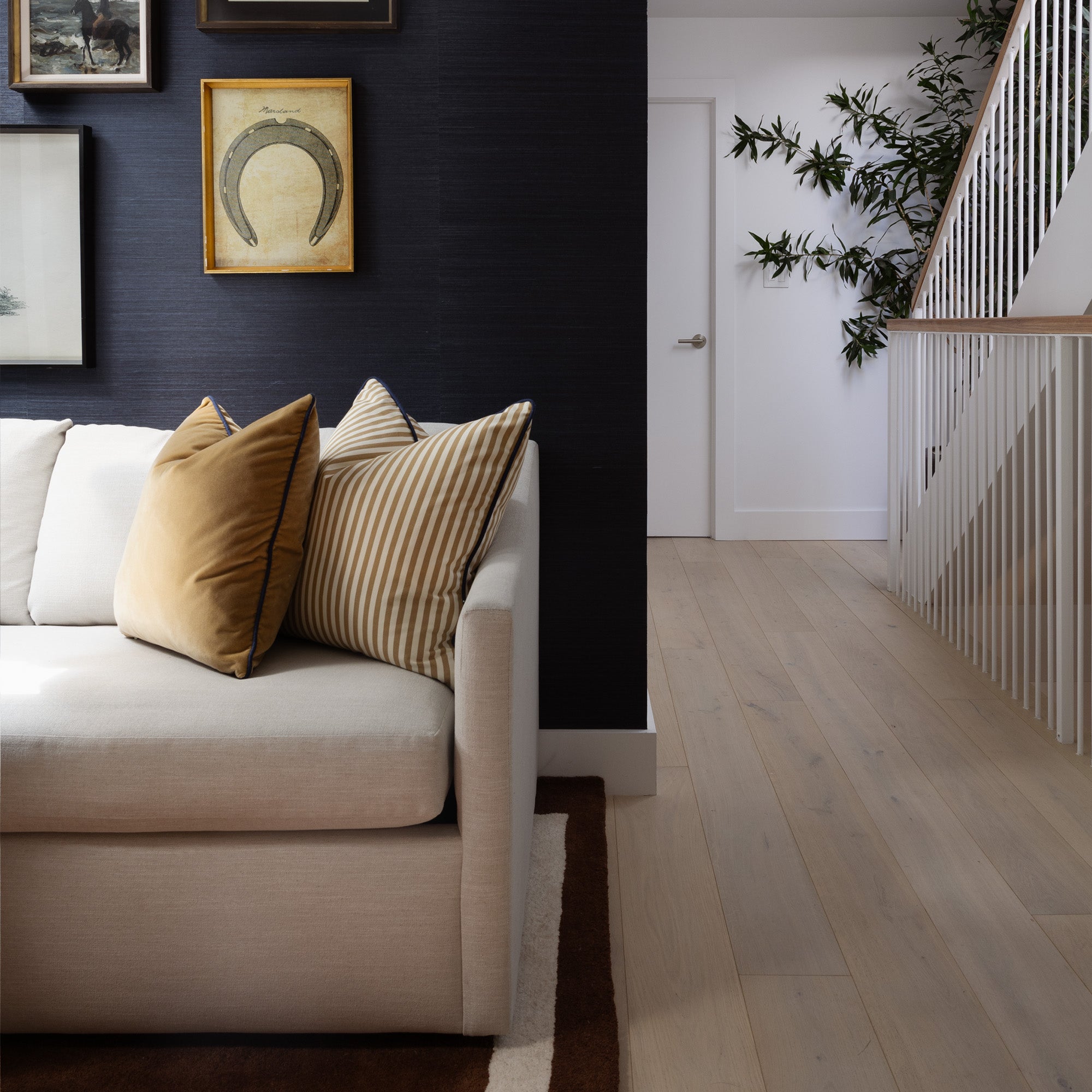 Louisa Camel cushions in warm earthy hues add a custom touch of timeless sophistication to this modern living room.