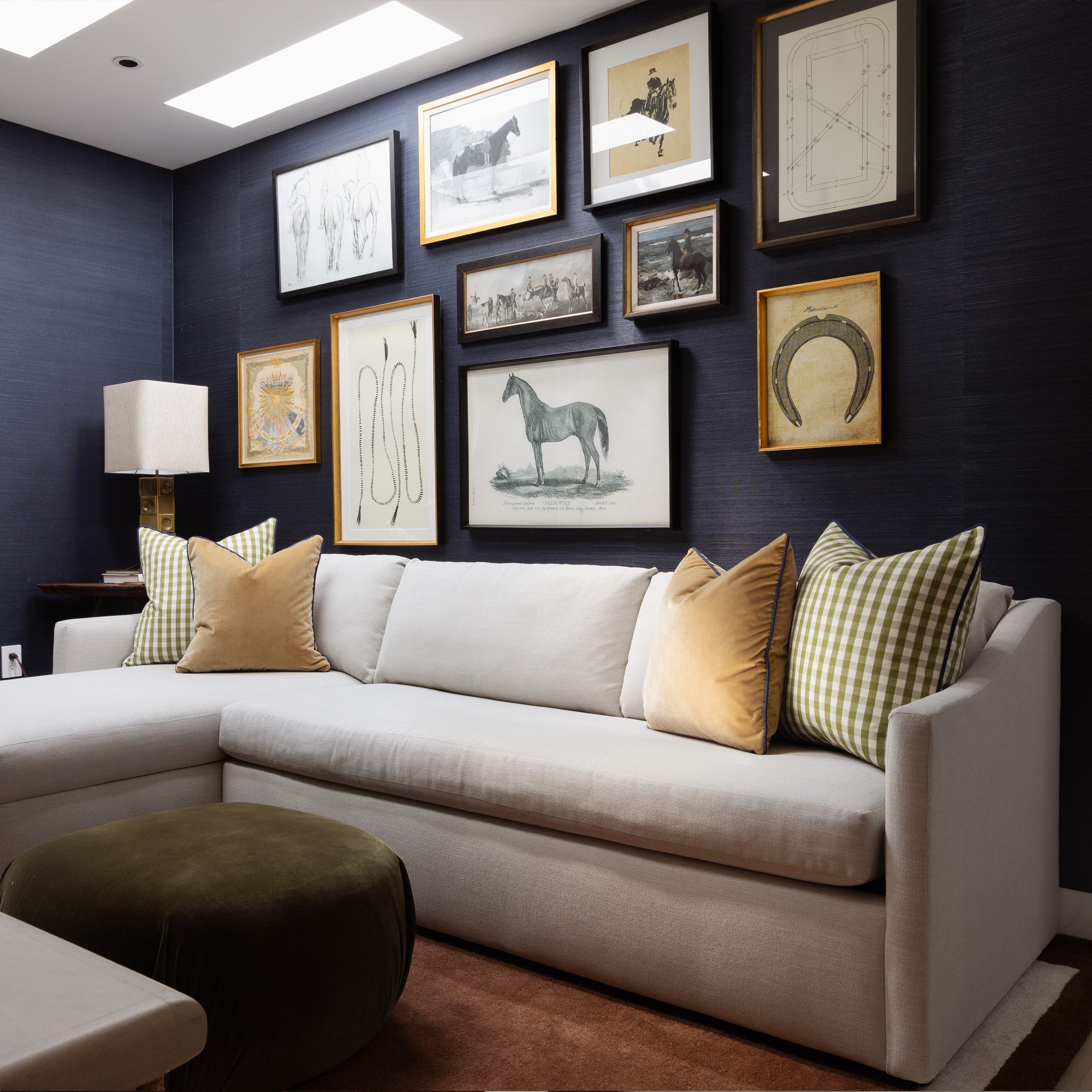 Millie Moss green gingham custom cushions add textured charm and modern style to this cozy, art-filled living room.