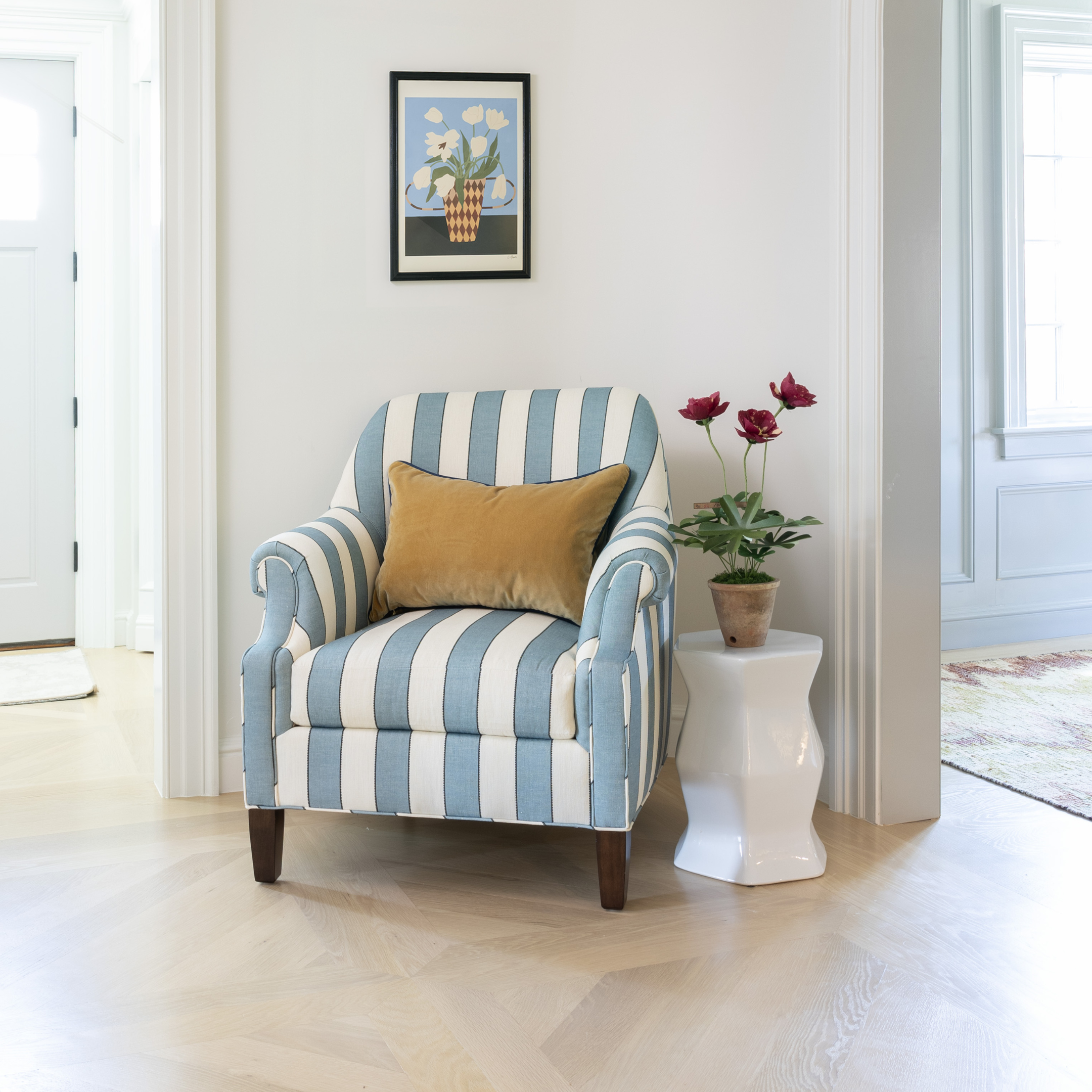 Florence Harbor Dorothy Chair with custom striped linen upholstery and mustard cushion in a bright, elegant living space.