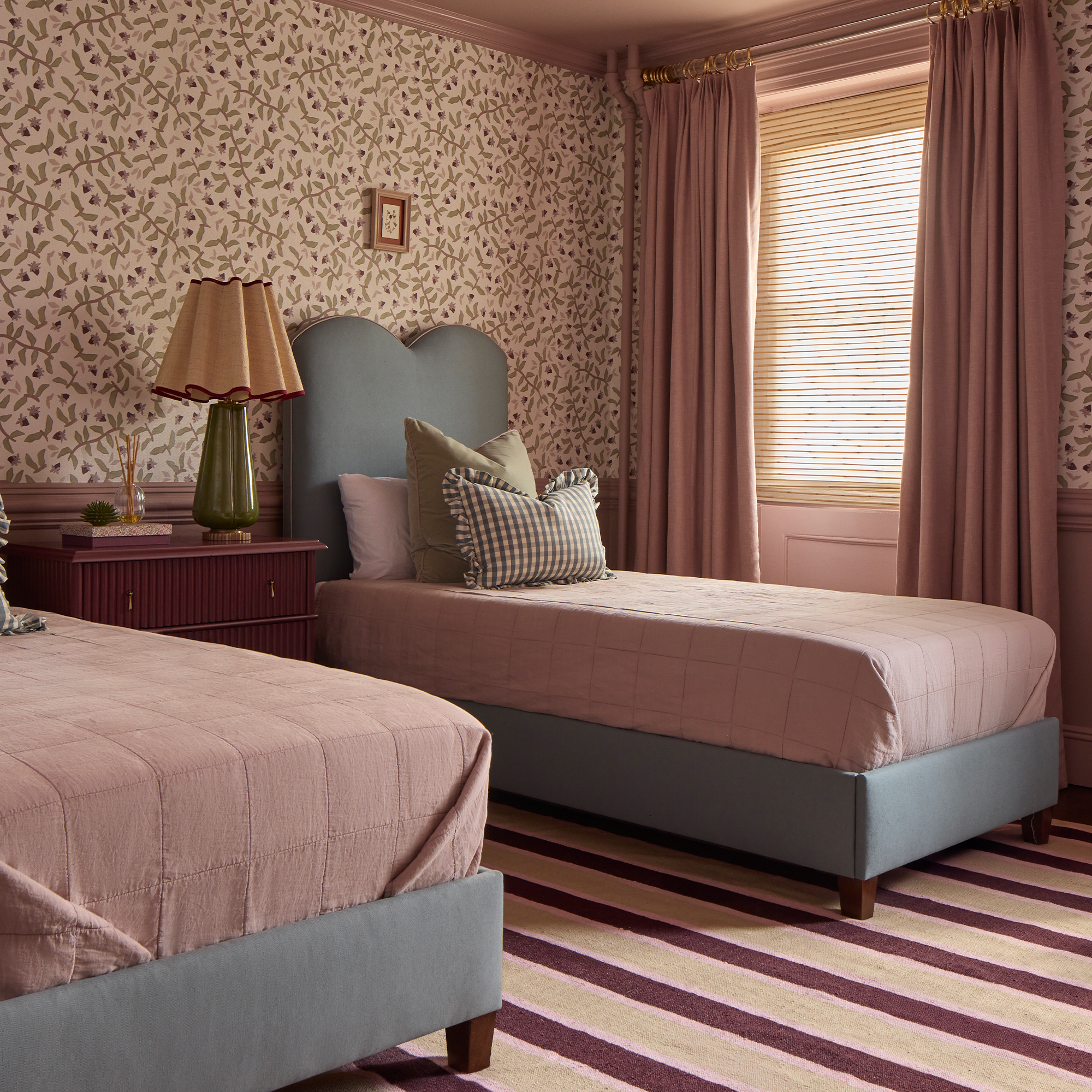 Cozy bedroom featuring Orchid custom curtains in soft pink from Pepper Home, offering airy, lightweight elegance and customizable length.