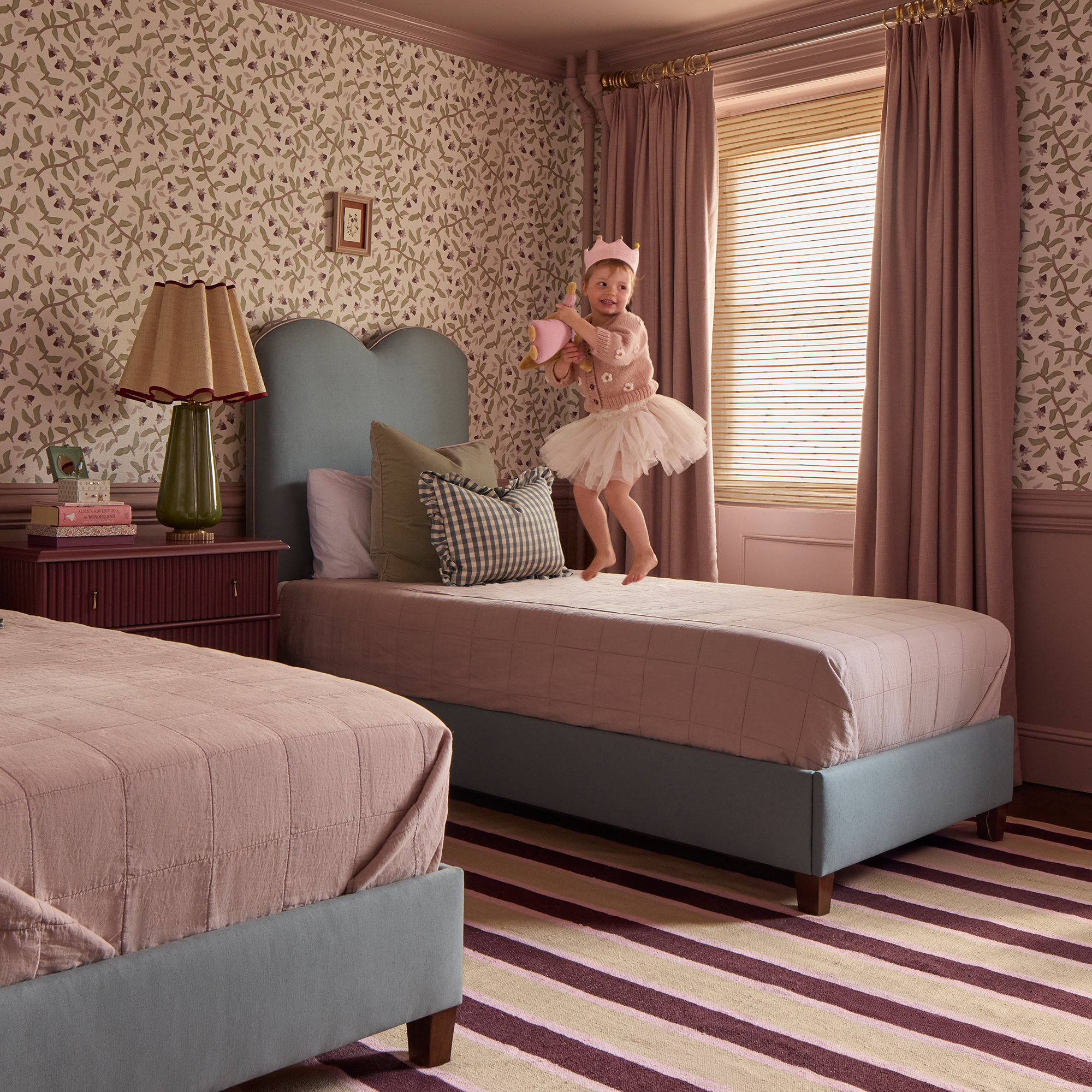 The Theodora Bed in Harbor linen fabric adds charm and personality to a cozy, elegant bedroom setting.