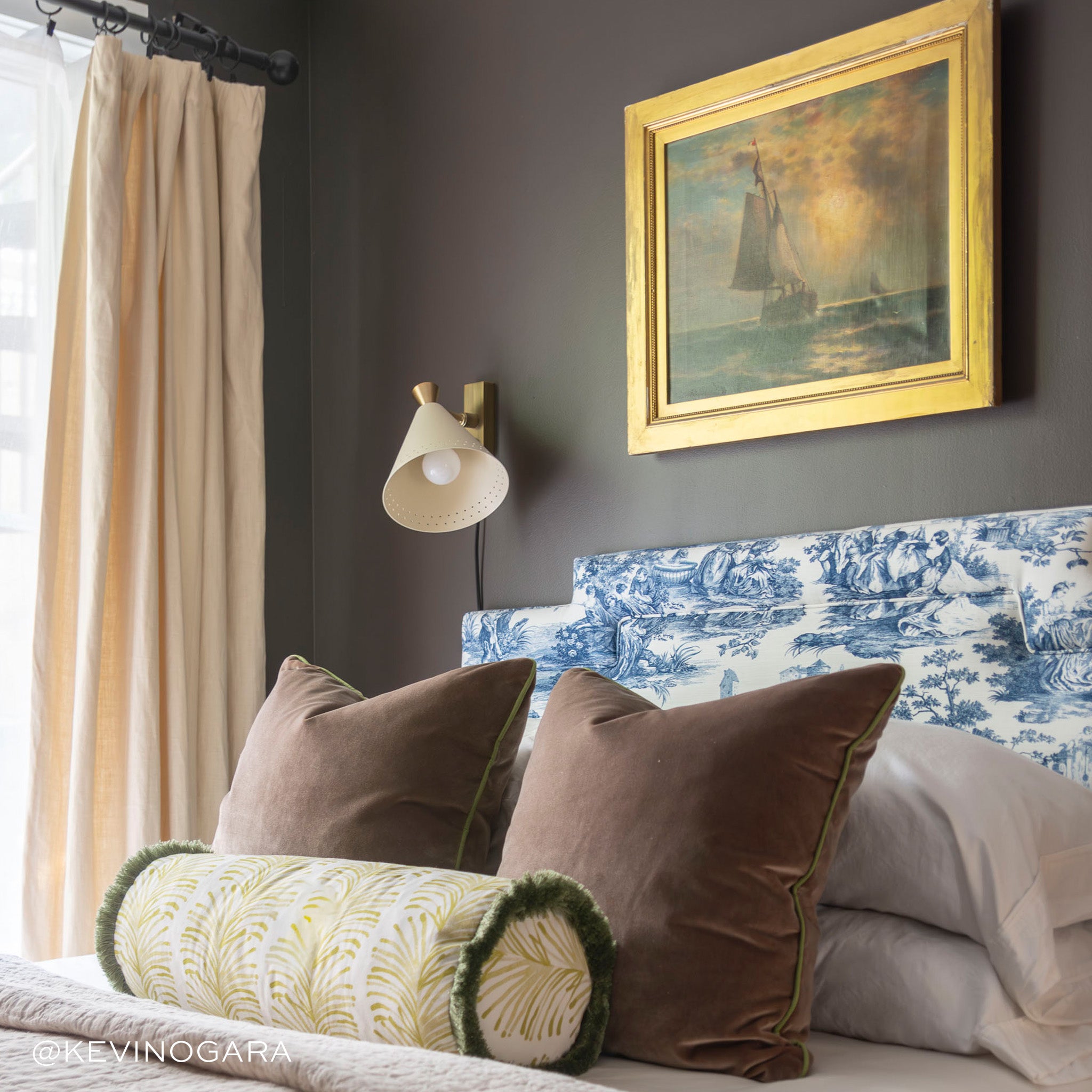Bed Close-Up styled with two Brown Velvet pillows and a Yellow Stripe Chartreuse Printed Bolster with Sage Fringe. Photo taken by Kevin O'Gara