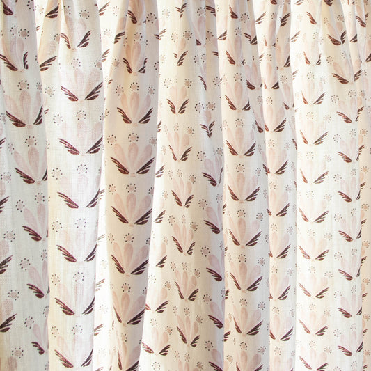 Serena Pink sheer curtains by Pepper Home feature custom floral and seashell-inspired patterns in soft pink and maroon tones.