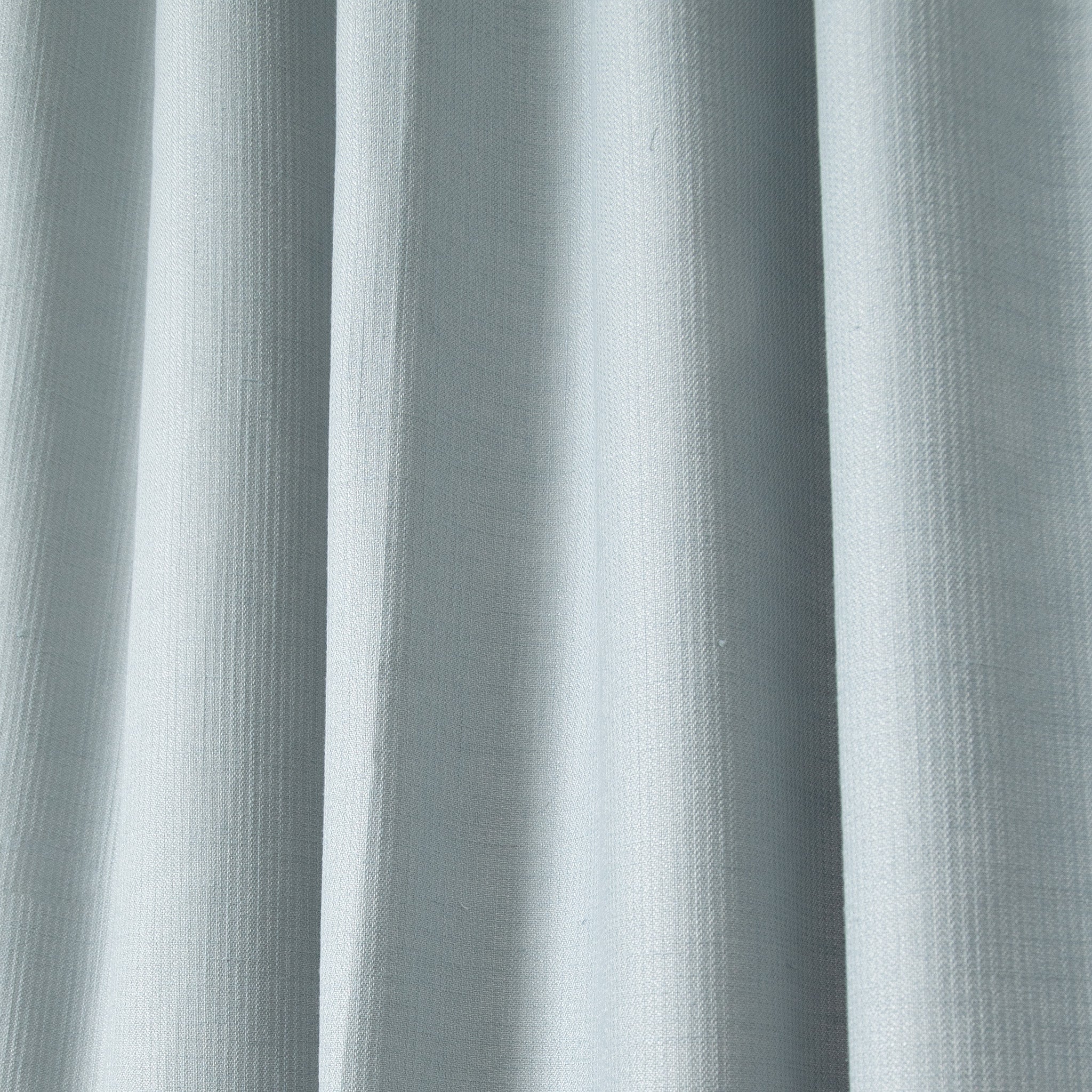 close up of grey blue shower curtain