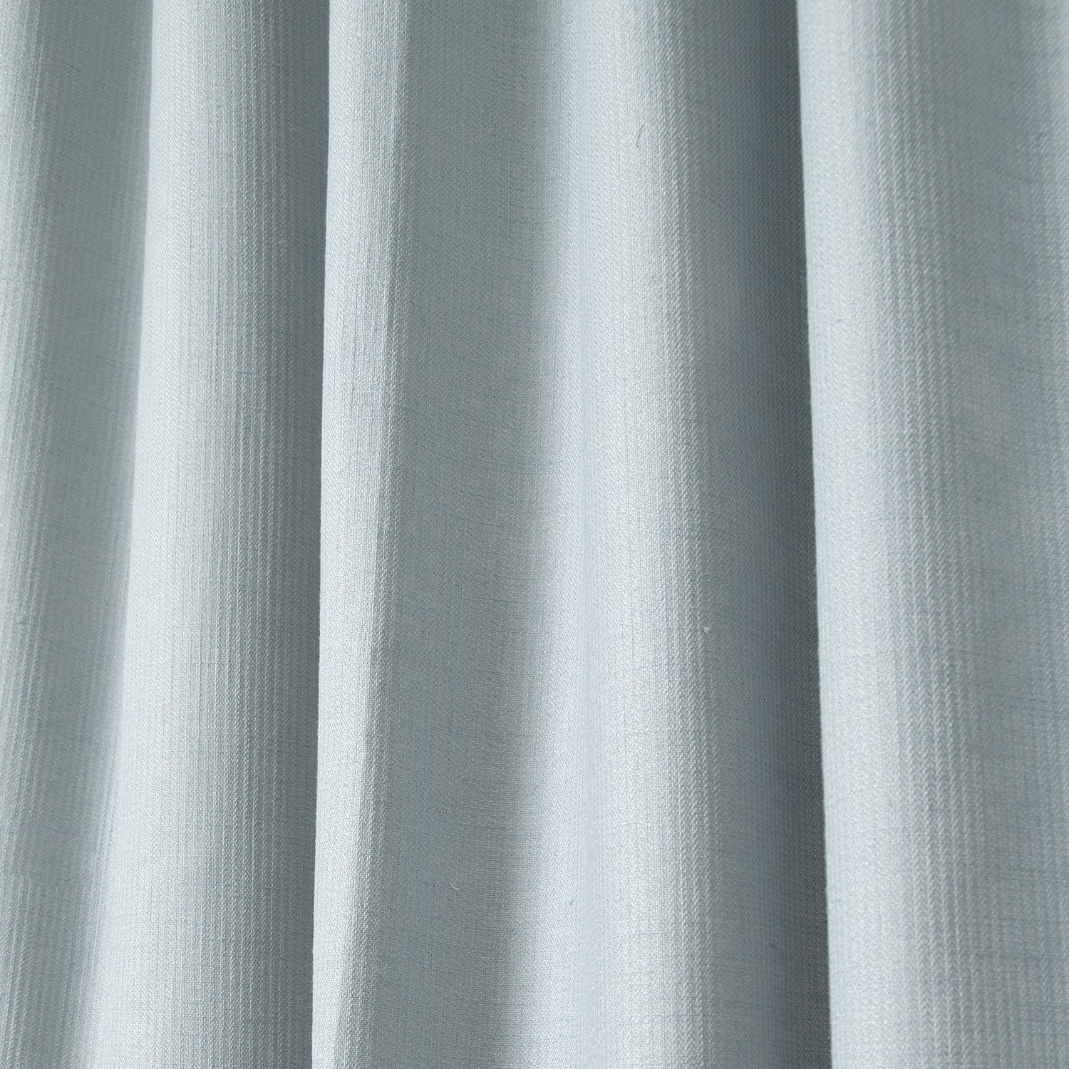 close up of grey blue shower curtain