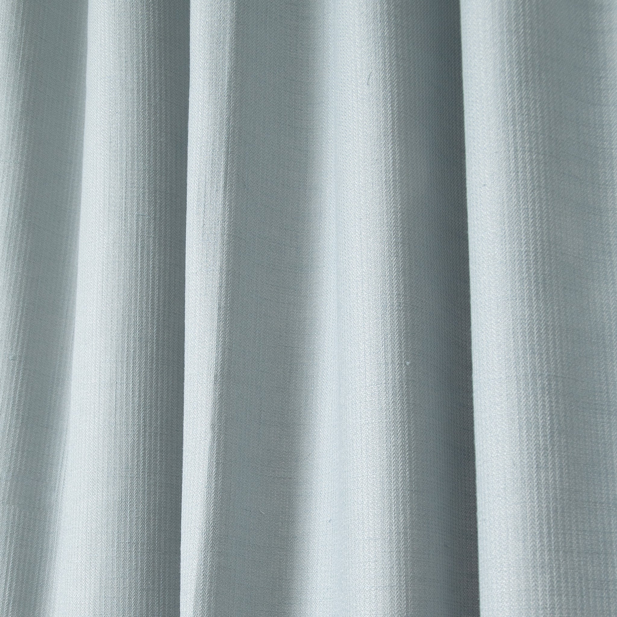 close up of grey blue curtains