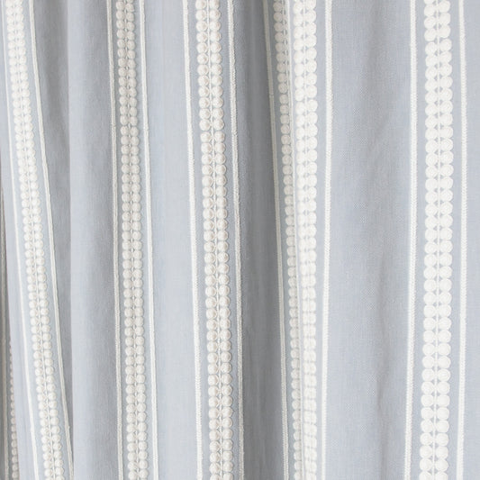 Soft textured fabric with vertical white embroidered stripes, showcasing Margot Mist Unlined custom sheer curtains by Pepper Home.