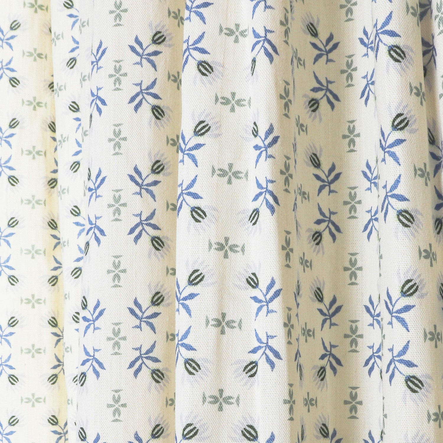 Lee sheer curtains by Pepper Home featuring delicate blue and green floral custom patterns for a fresh, tranquil look.