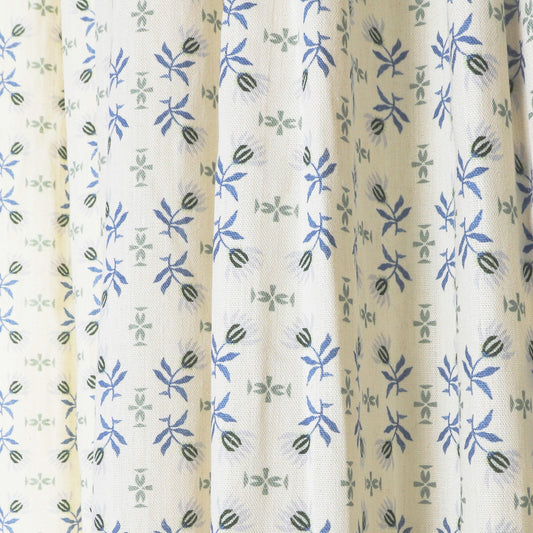 Lee sheer curtains by Pepper Home featuring delicate blue and green floral custom patterns for a fresh, tranquil look.
