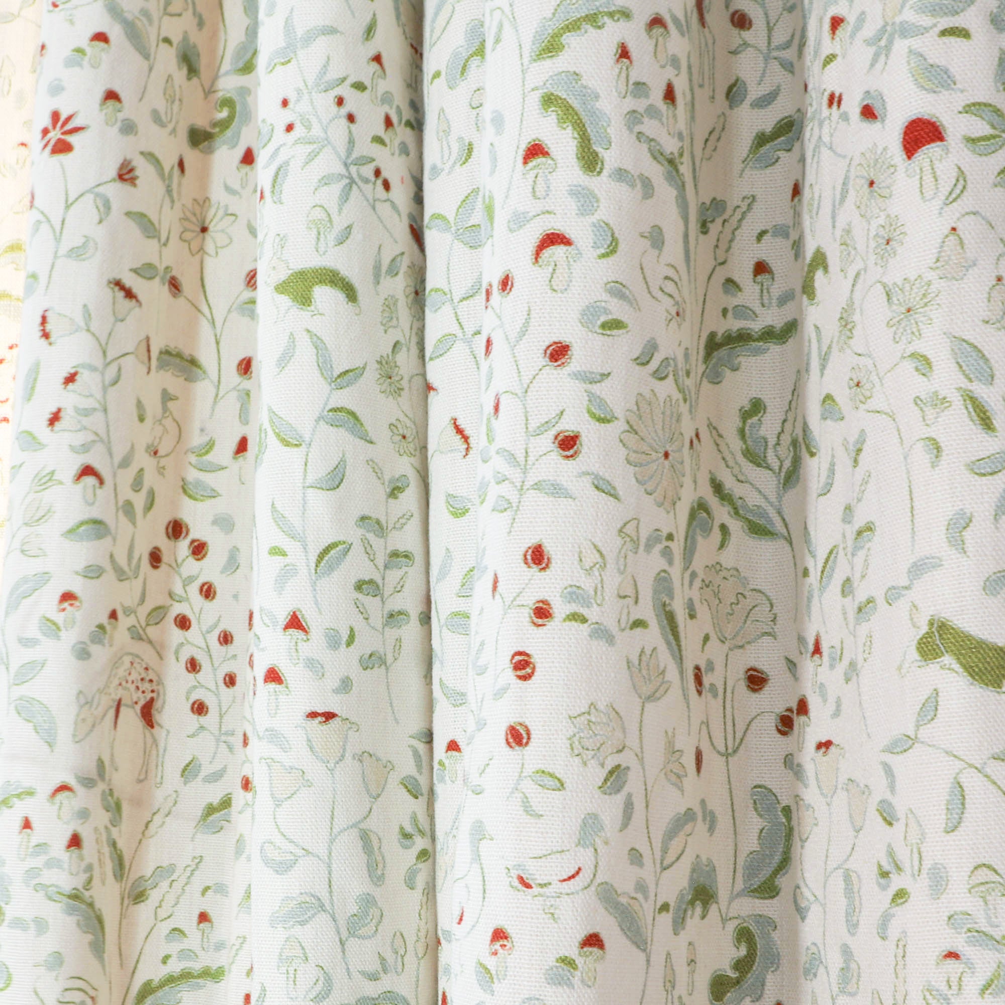 Ruby Moss custom curtains feature enchanting woodland and floral motifs, adding charm and elegance to your home.