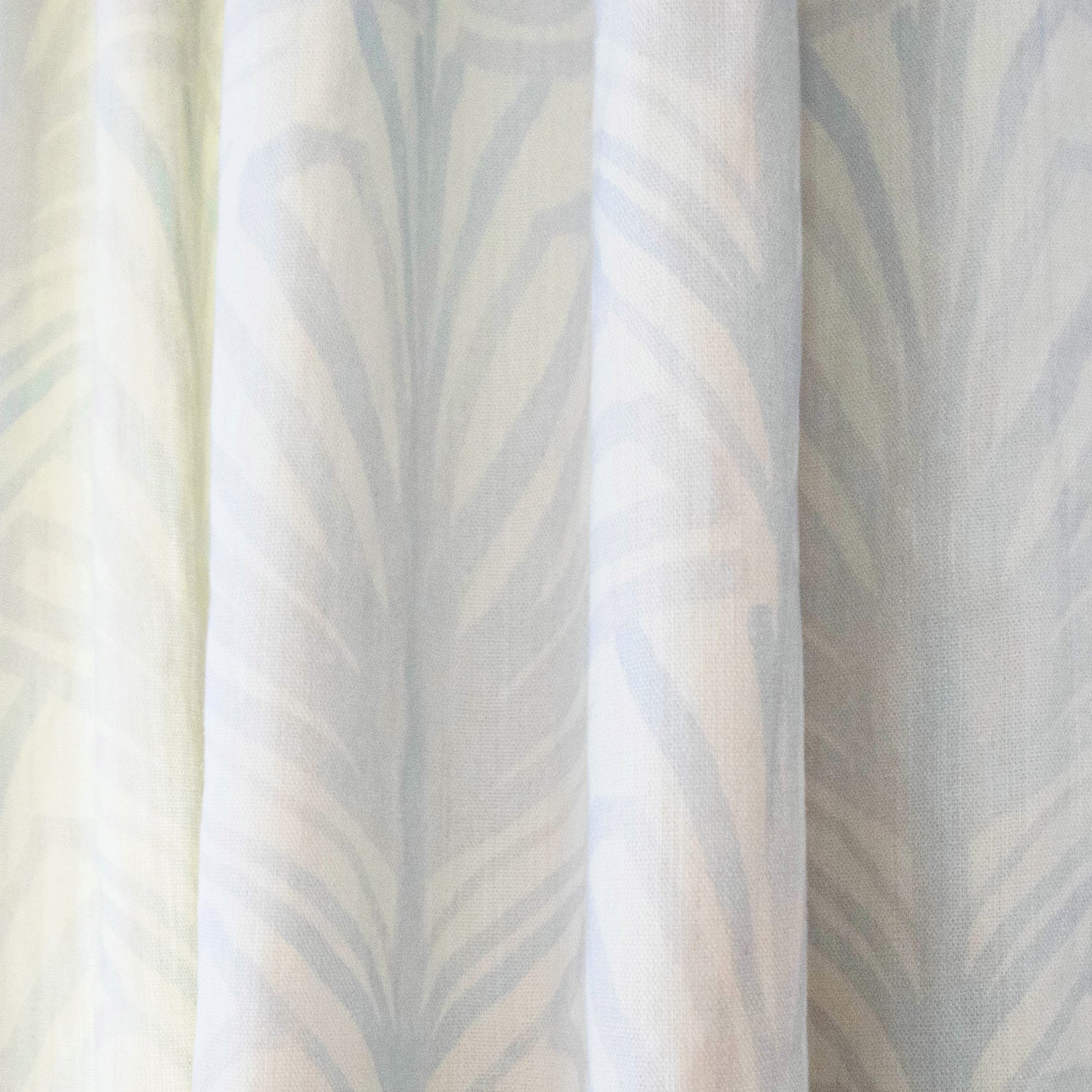Suzy Sky custom sheer curtain with hand-painted palm motifs in soft sky-blue for airy, elegant home decor by Pepper Home.