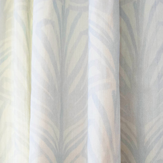 Suzy Sky custom sheer curtain with hand-painted palm motifs in soft sky-blue for airy, elegant home decor by Pepper Home.