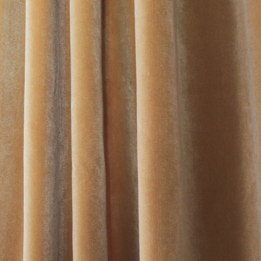 Close-up of Camel Velvet fabric in warm golden tones, showcasing soft texture for custom Pepper Home curtains.