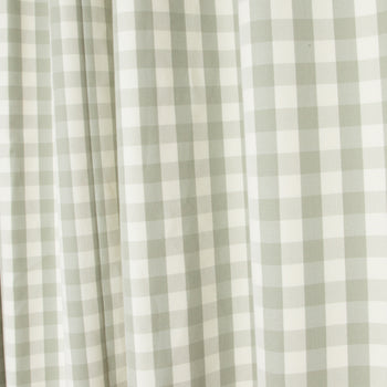 Millie Sage Unlined custom curtains by Pepper Home, featuring soft green check pattern for a fresh, welcoming space.