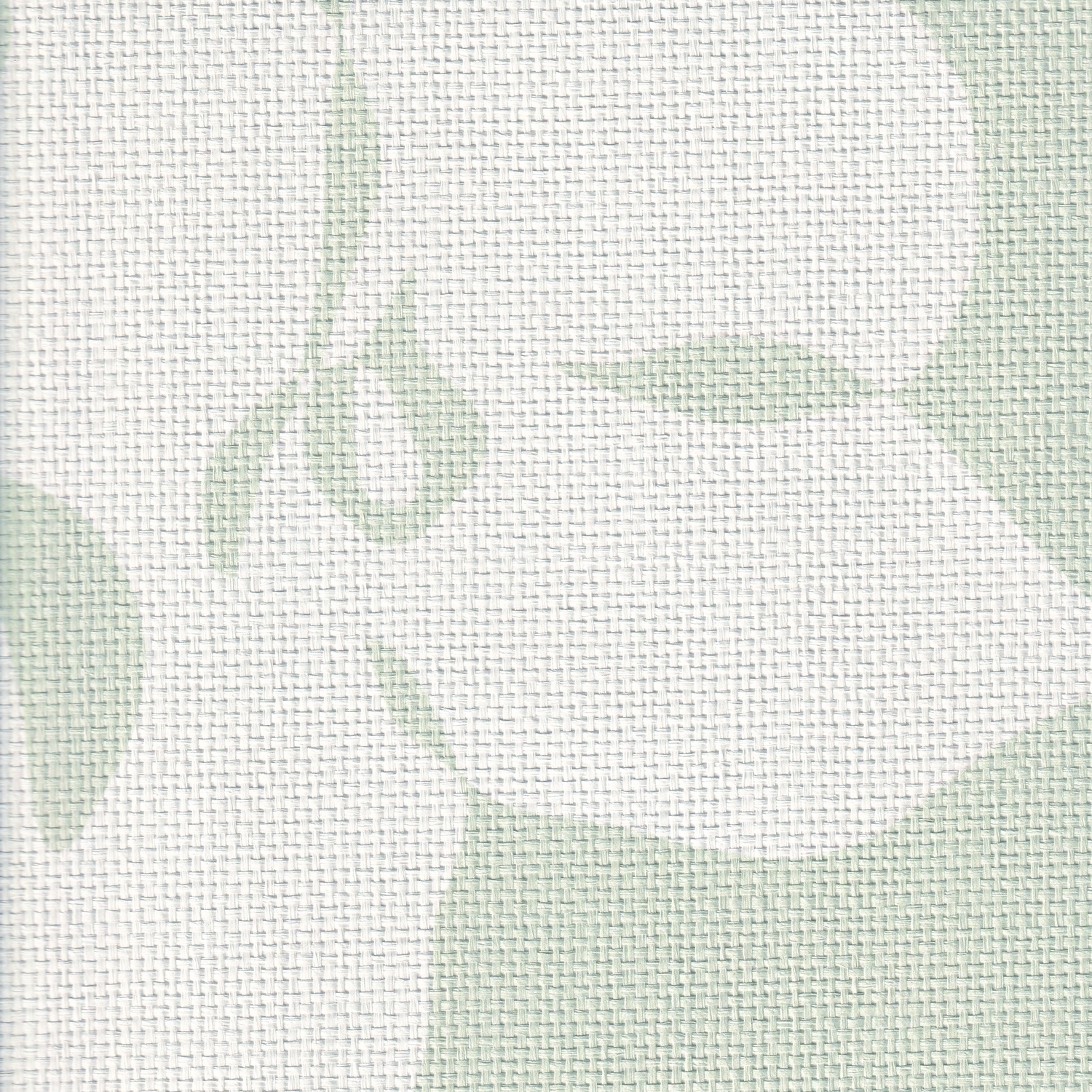 close up of green and white grasscloth wallpaper