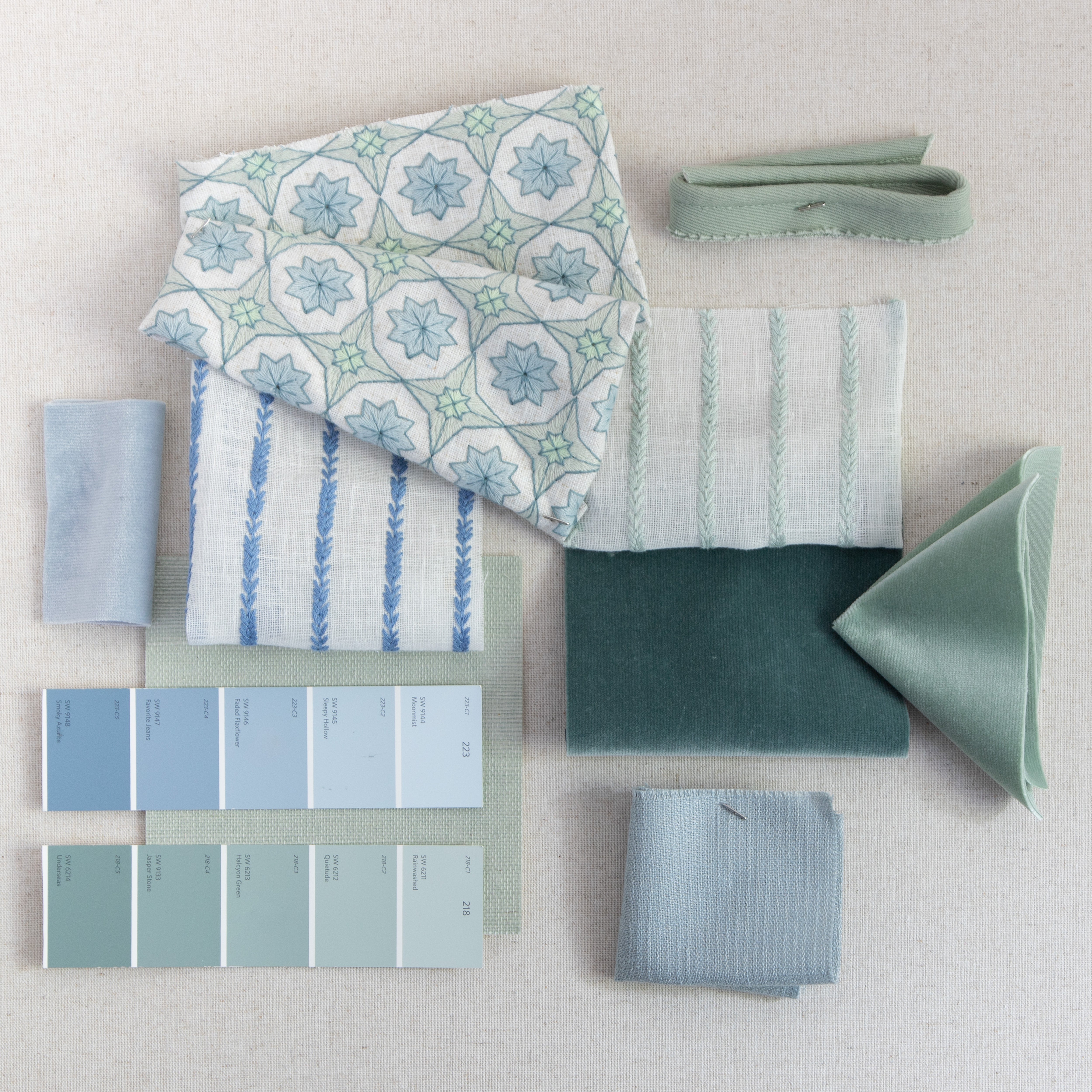Hayes Sea Salt fabric swatches featuring textured linen blend with geometric embroidery and soft green and blue hues.