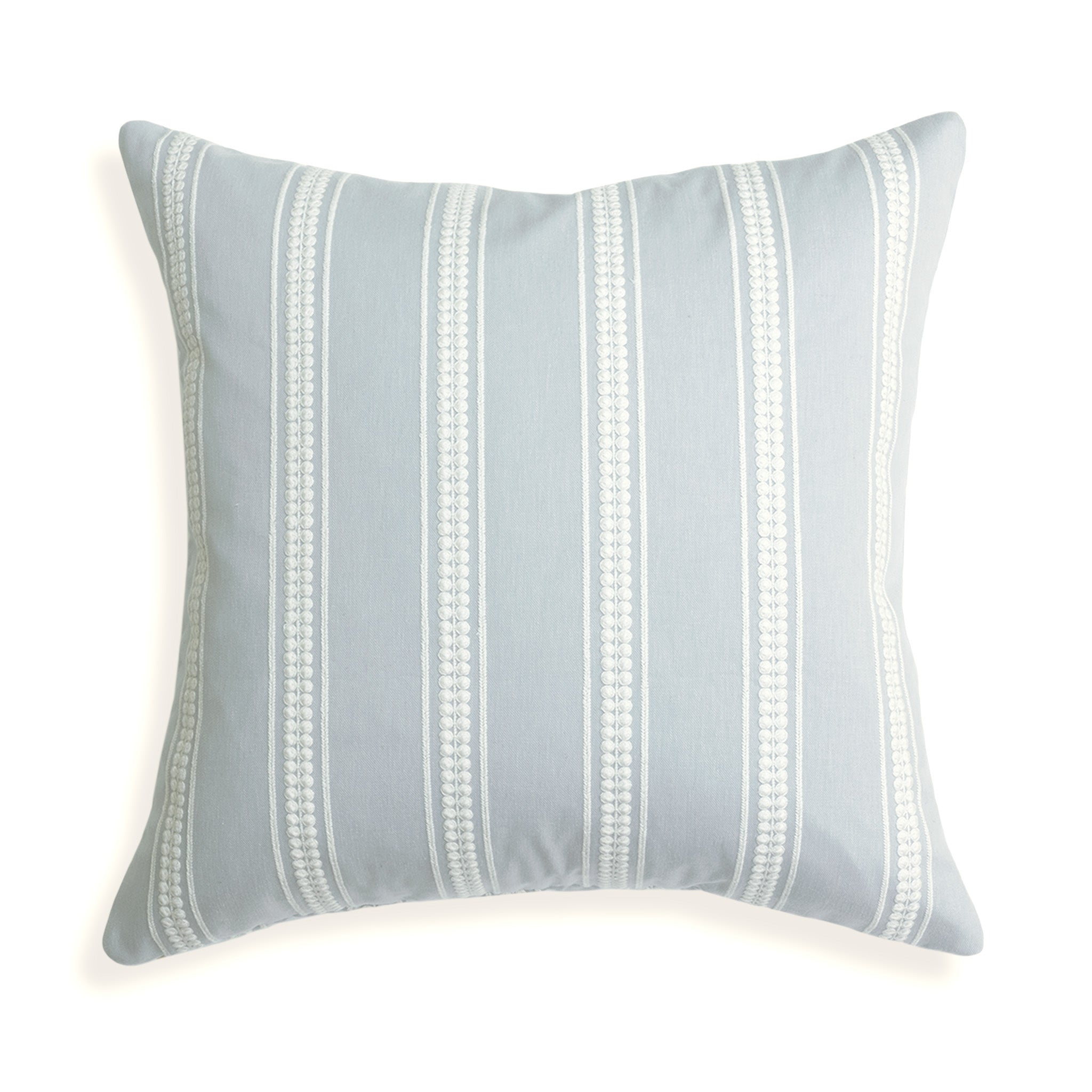 Margot Mist pillow with custom white embroidered stripes on soft blue, bringing serene coastal charm to your space.