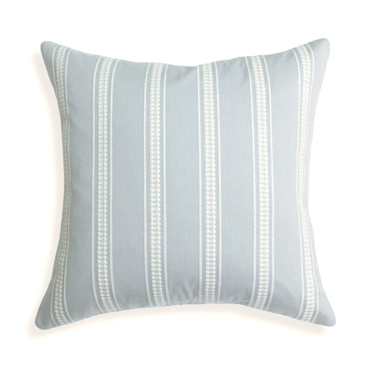 Margot Mist pillow with custom white embroidered stripes on soft blue, bringing serene coastal charm to your space.