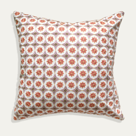 Hayes Coral pillow with intricate embroidery and geometric pattern, adding dimension and durability to any room.
