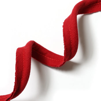 Cherry red piping detail adding the perfect finishing touch to custom Pepper Home curtains and cafe curtains.