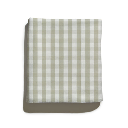 Folded custom gingham fabric in muted green with woven texture and check pattern, Millie Sage by Pepper Home.