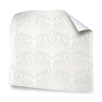 Suzy Mint wallpaper sample with hand-painted palms and scallop pattern in mint and pale pink by Pepper Home.