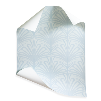 Suzy Sky wallpaper with hand-painted palm motifs in soft sky-blue by Pepper Home, perfect for custom interiors.