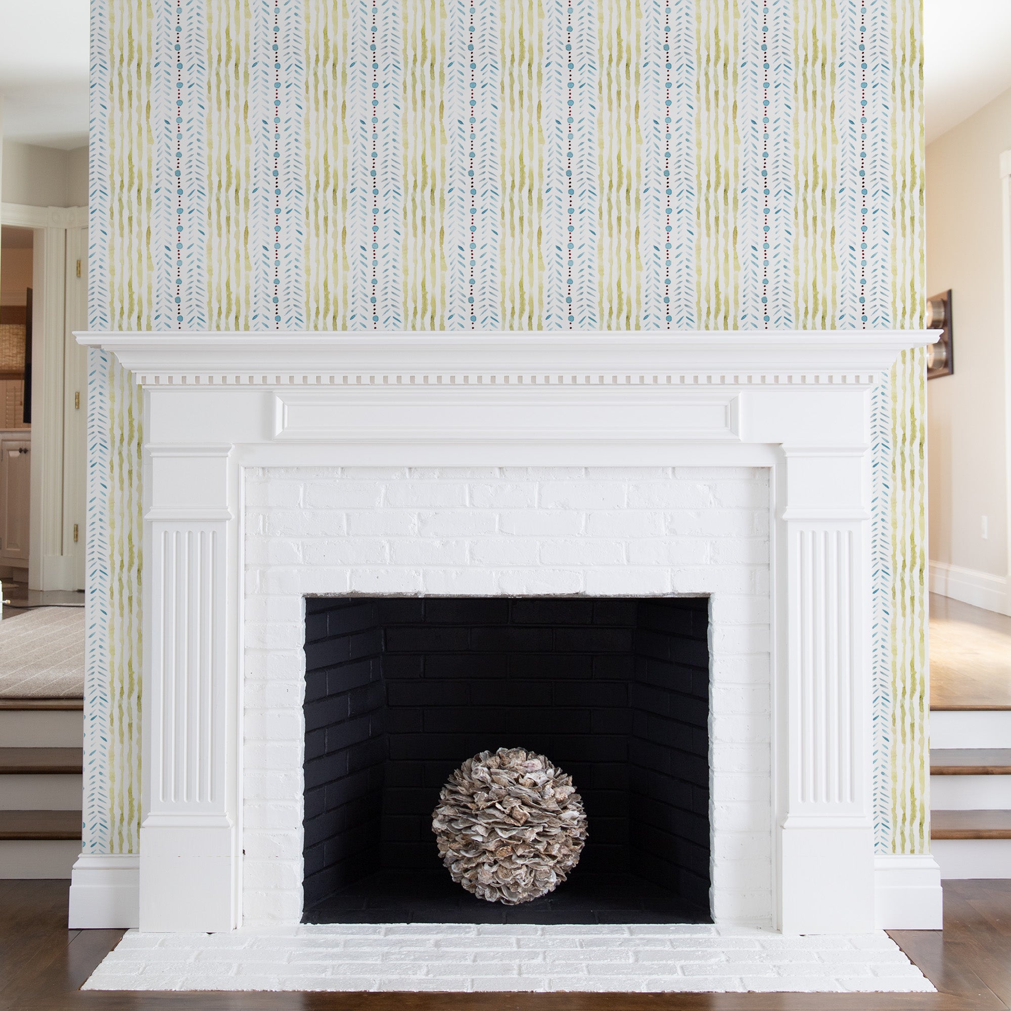 Living room fireplace styled with a Blue & Green Striped Printed Wallpaper 