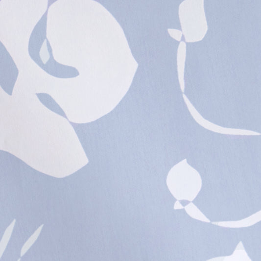 Georgia Cornflower fabric in soft cornflower blue with abstract continuous-line botanical print by Pepper Home.