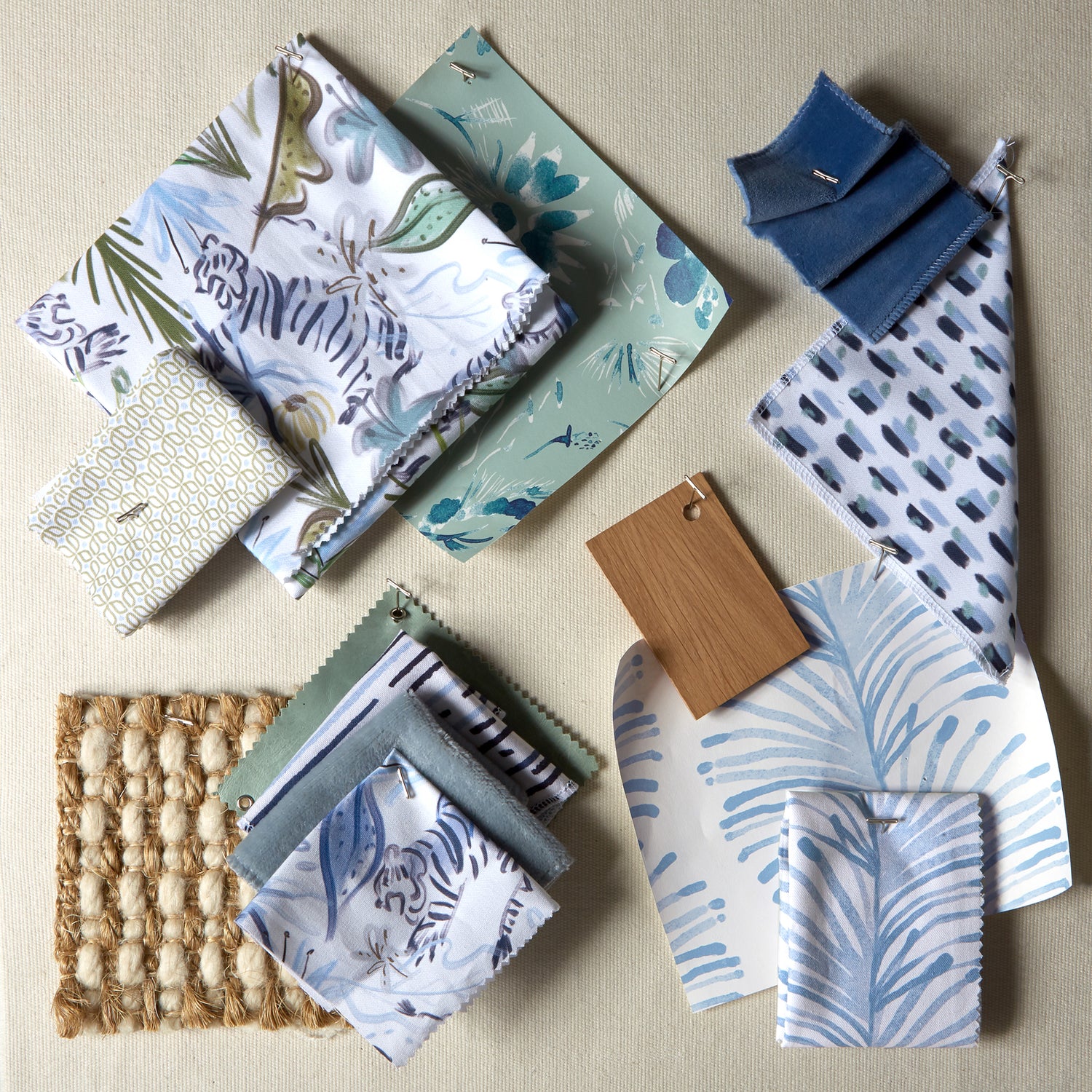 Interior design moodboard and fabric inspirations with Blue Chinoiserie Tiger Printed Swatch, Sky Blue Printed Swatch, Moss Green Geometric Printed Swatch, Sky Blue Botanical Stripe Printed Swatch, and navy velvet swatch