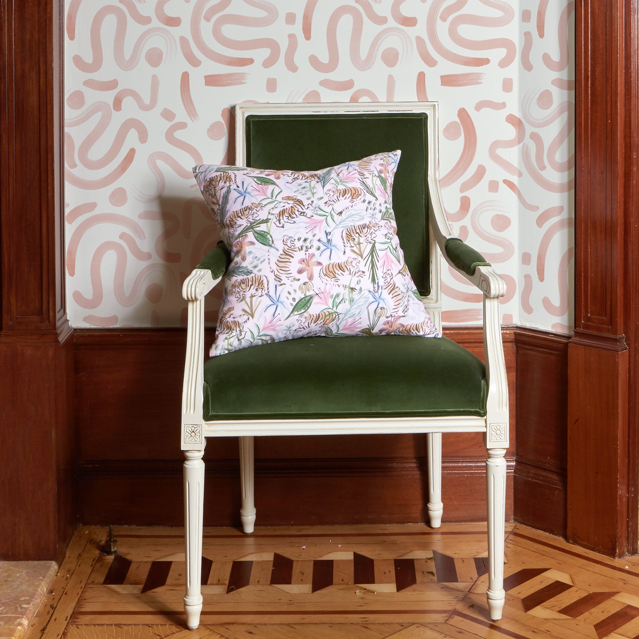 Green Velvet Chair Close-up with Pink Chinoiserie Printed Pillow and Pink Graphic Printed Wallpaper