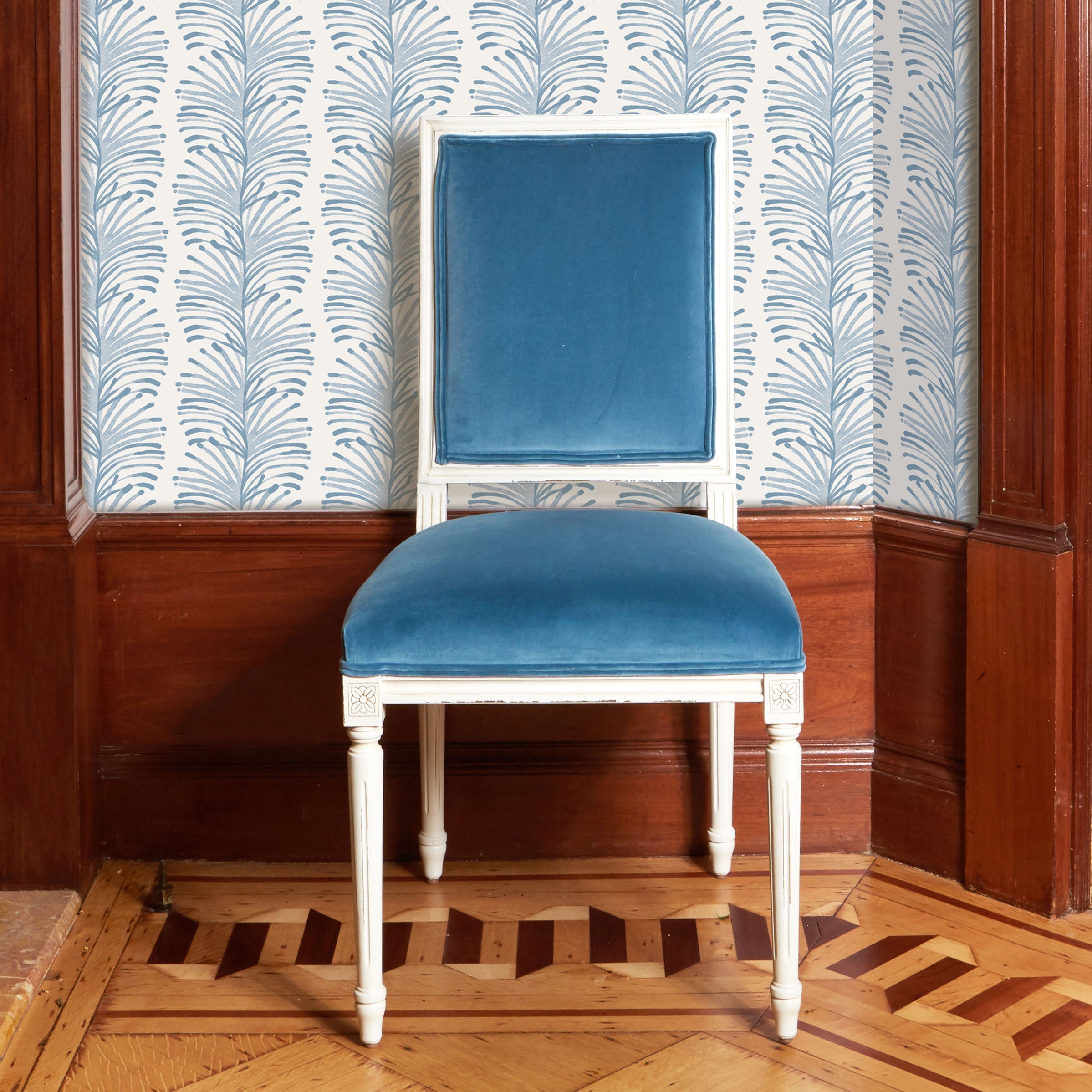 Corner styled with Sky Blue Botanical Stripe Printed Wallpaper and Blue Velvet white wooden chair in front