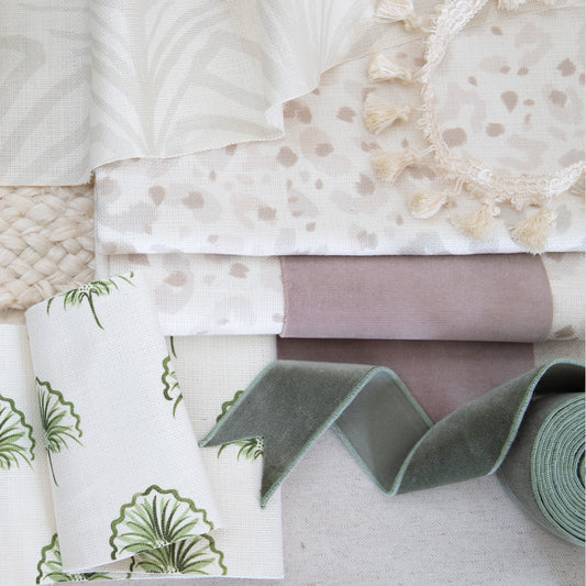 Neutral and green interior design moodboard with beige animal print cotton fabric, green floral fabric, beige palm fabric and green velvet trim