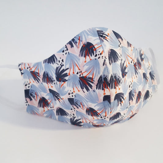 Blue and pink floral cotton face mask on a white background