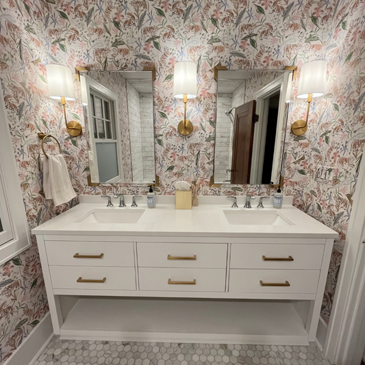 Bathroom with pink chinoiserie tiger wallpaper and large white vanity