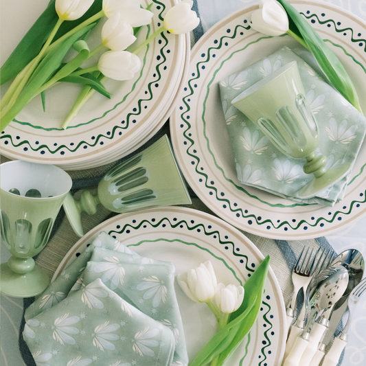 White Plates close-up with tulips and Blue & Green Floral Drop Repeat custom napkins 