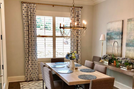 Dining room with a wooden long table and brown chairs in front of window styled with Art Deco Palm Pattern Custom Curtains 