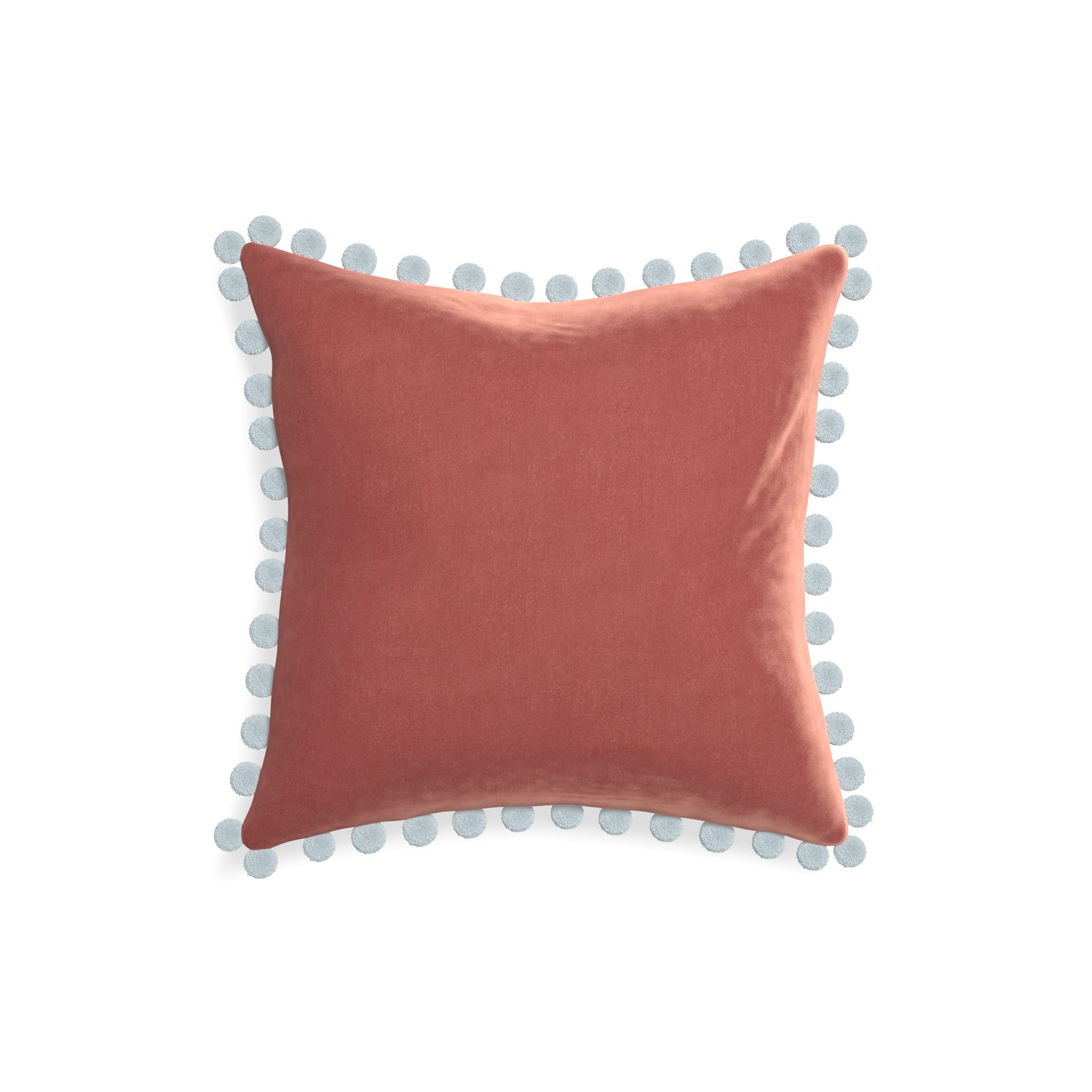 square coral velvet pillow with light blue pom poms