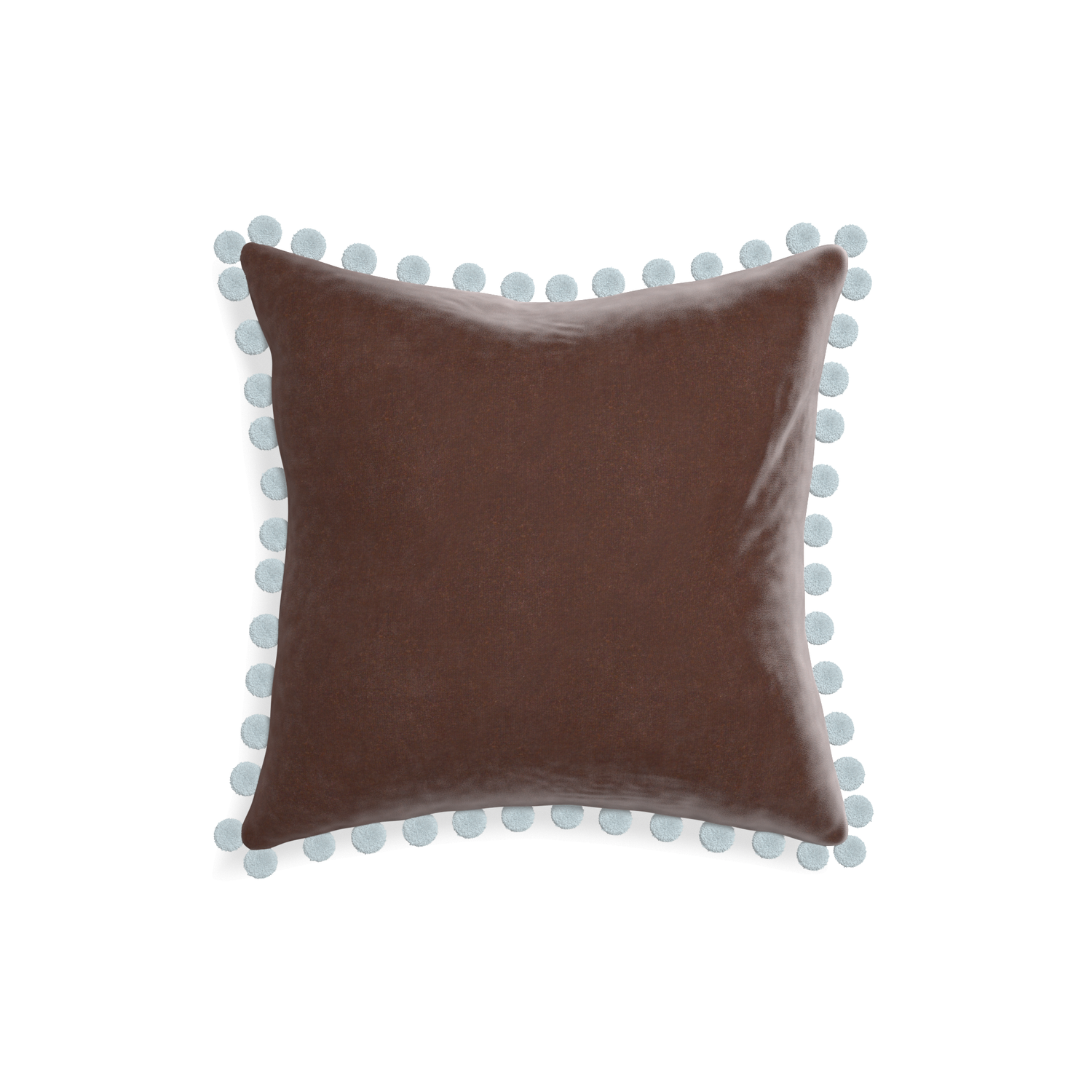 square brown velvet pillow with light blue pom poms