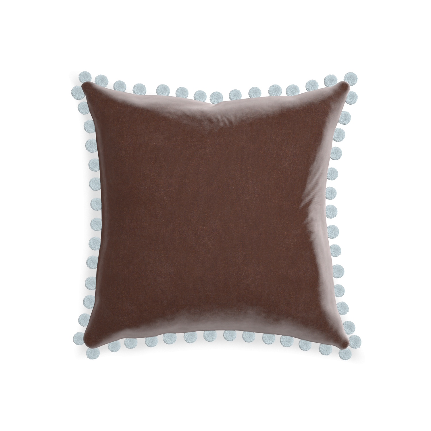 square brown velvet pillow with light blue pom poms