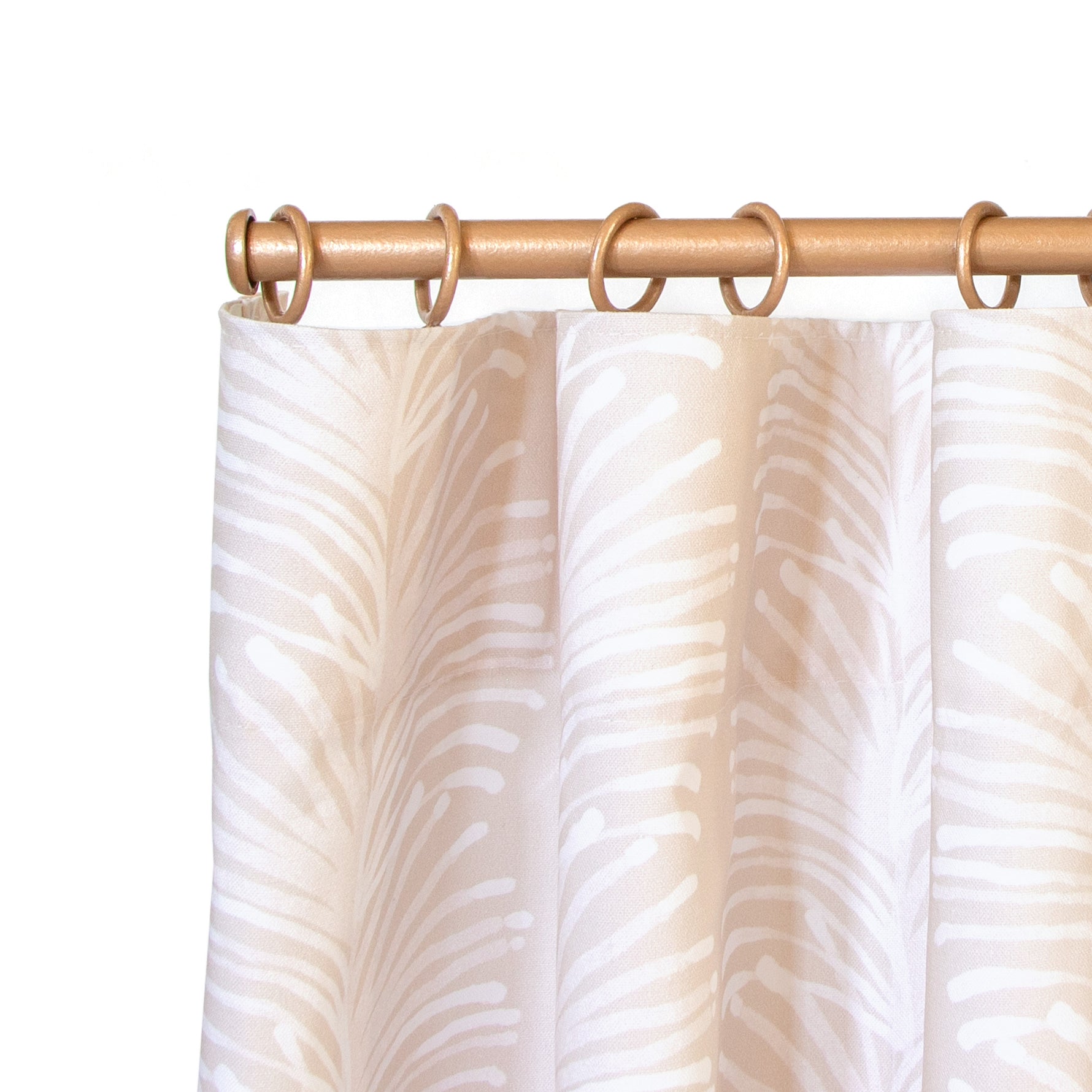 close up of beige botanical stripe ring top cafe curtain on a light brown rod