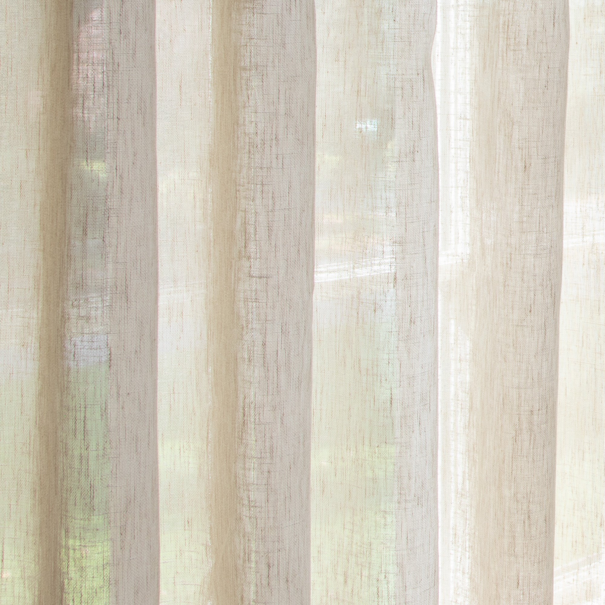 close up of sheer light brown curtain 