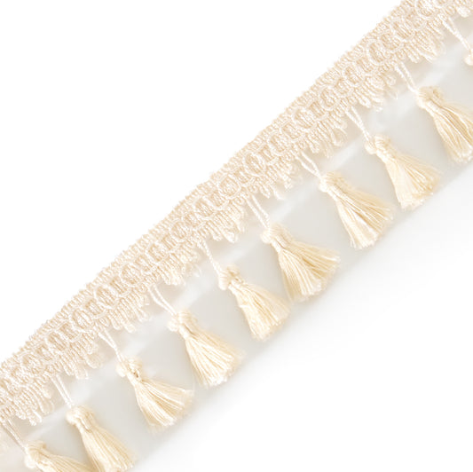 Cream colored tassel diagonally laying across the image