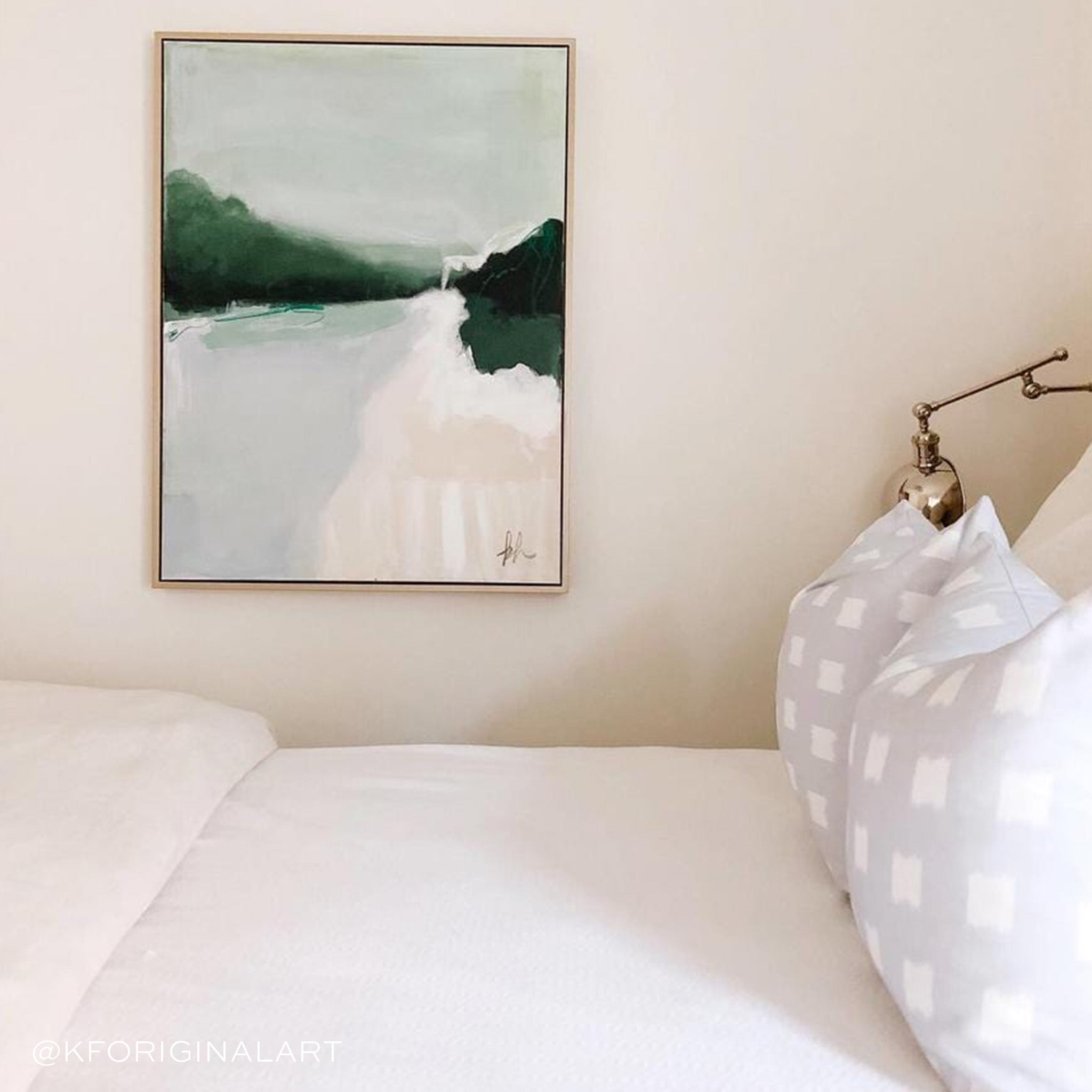 Bedroom styled with two Sky Blue Pattern printed pillows on white bed with the back having a landscape painting to the left and silver lamp on the right. Photo taken by @KFORIGINALART