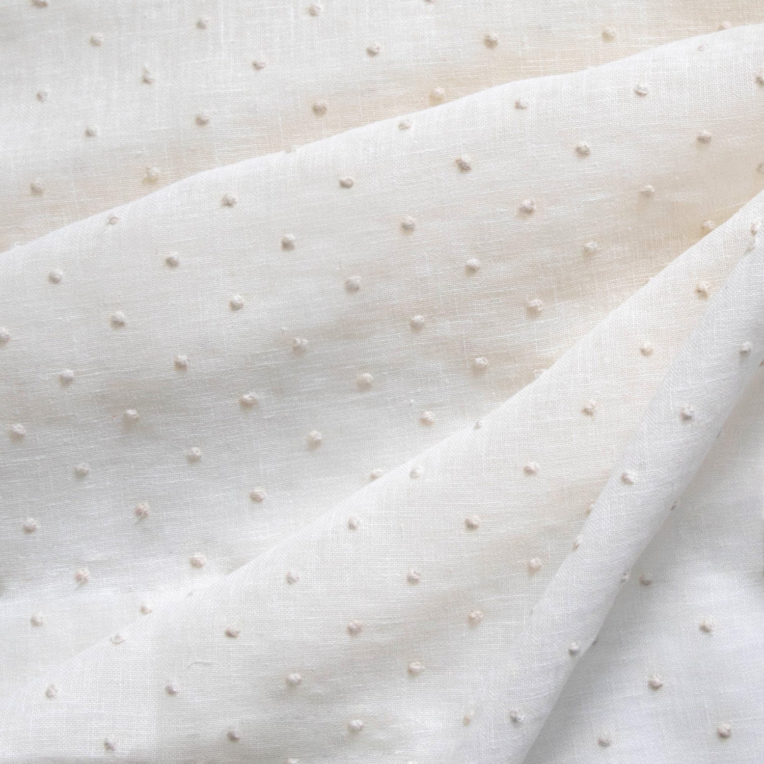 sheer white embroidered cream polka dot fabric