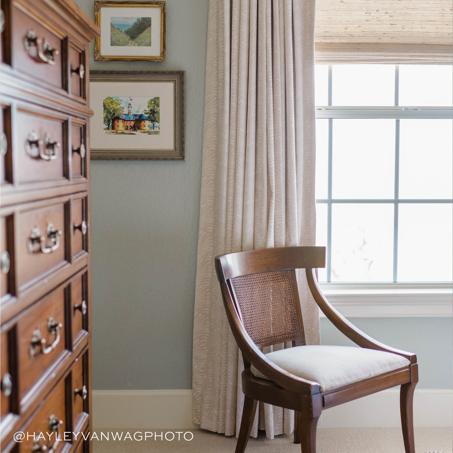 Corner styled with Beige Botanical Stripe Printed Curtain in front of illuminated window with wooden chair next to wooden drawers. Photo taken by Hayley Vanwag Photo