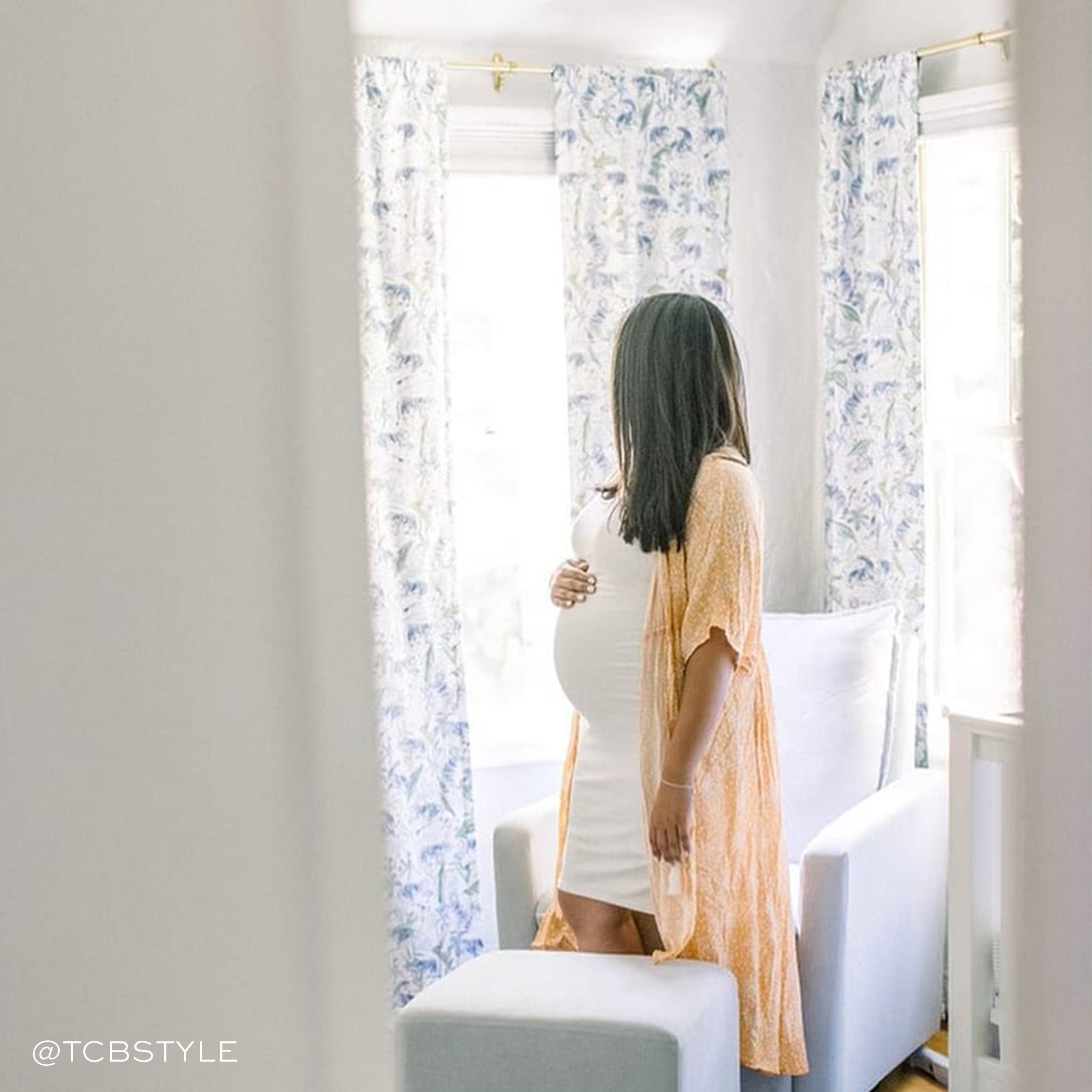 Nursery room close-up of pregnant brunette woman styled with Green Tiger Printed Curtains. Photo by TCB Style